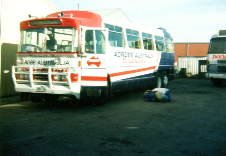 Denning 11.3 metre coach.fleet #18.Used mainly on tours.Was orginally part of the Quest Tours fleet prior to the purchase of the company by Max Winkless in 1985.Was repainted in &quot;The Bus Company's-Across Australia Coachlines&quot; livery.This photo was taken at the depot one December morning in 1985 after the Parlorcars Denning next to it had arrived from the Perth to Adelaide service in which I was one of 2 coach captains on that service.My first express service.