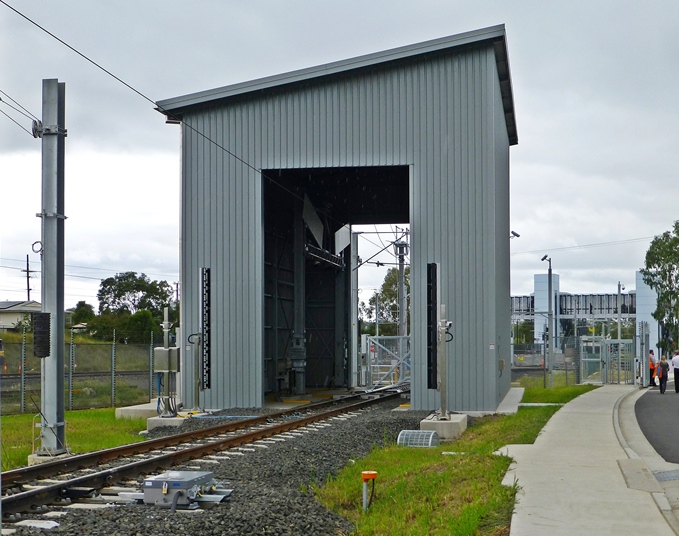 The Train Inspection Building at the Wulkuraka entrance to the Maintenance Centre. The trains drive through and are scanned automatically to provide vehicle condition data on wheels, brakes, pantograph and exterior of the cars.