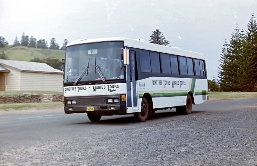 5394
Pinetree Tours + Marie’s Tours Hino at Kingston, Norfolk Island in the nineties. 
Keywords: locolesphoto hino
