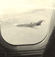 Boeing 727-100 in flight looking out from a Boeing 707.In Flight over USA.