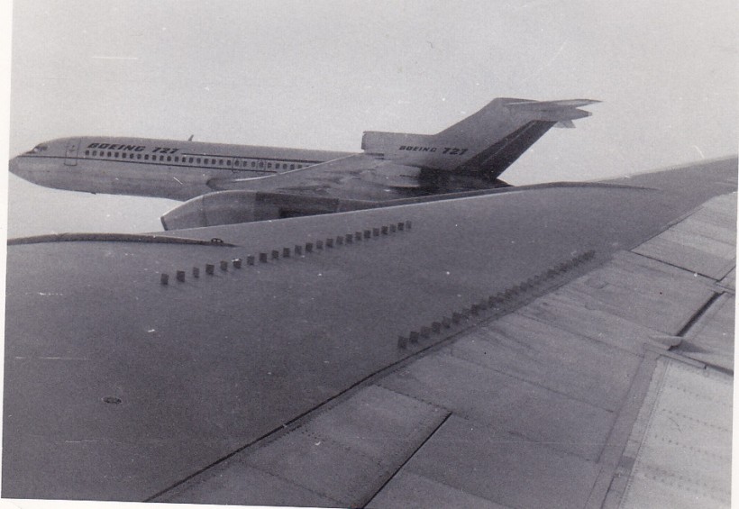 Close up Boeing 727-100 in flight from Boeing 707 over USA.