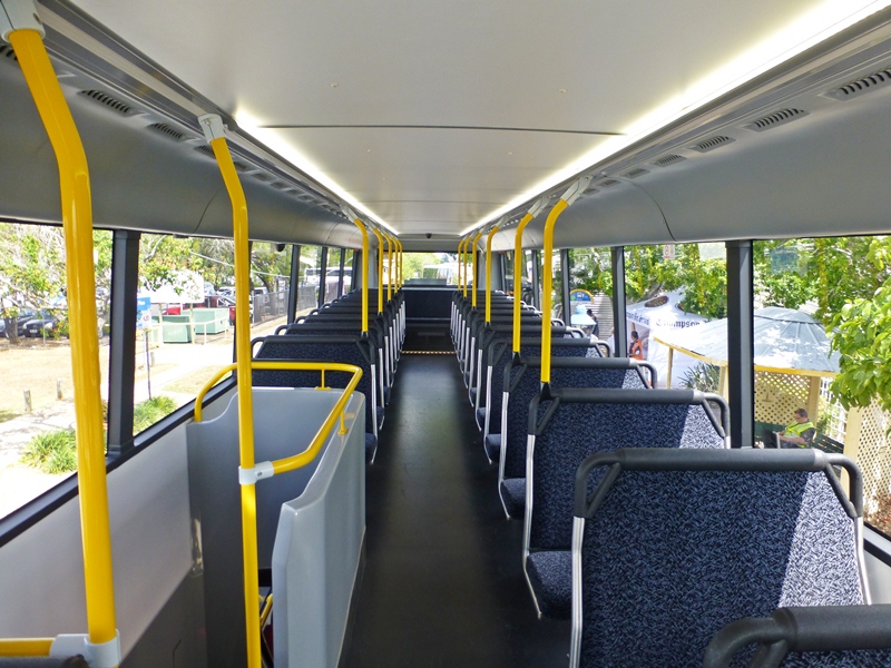 A view of the top deck looking towards the back. Plenty of leg room between the seats. No adverts over the windows so you can see out. A bus height of 4.4 metres gives good head room on both decks.