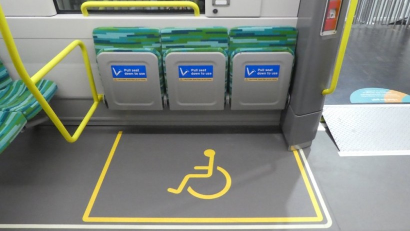 Wheelchair bay with foldable seats.