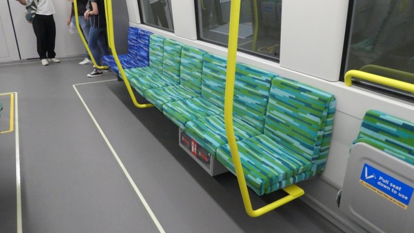 Bench seats in the middle of the carriage.